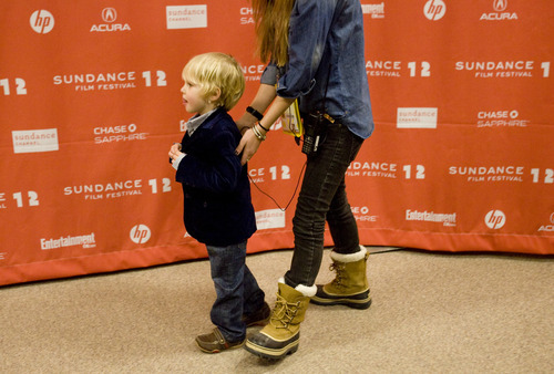 Kim Raff |The Salt Lake Tribune
Child actor Finn Donoghue is escorted the red carpet before the premiere of 