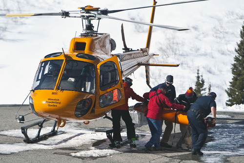 Chris Detrick  |  The Salt Lake Tribune
Rescuers carry out a body from a Wasatch Powderbird helicopter at Snowbird Saturday January 28, 2012. One person died in an avalanche in the backcountry between Big and Little Cottonwood canyons late Saturday morning. Unified Police Department Lt. Justin Hoyal said a group of three people were skiing on Kessler Ridge, an area that drops down into Mineral Fork Canyon in Big Cottonwood Canyon, when the avalanche was triggered at about 11:30 a.m.