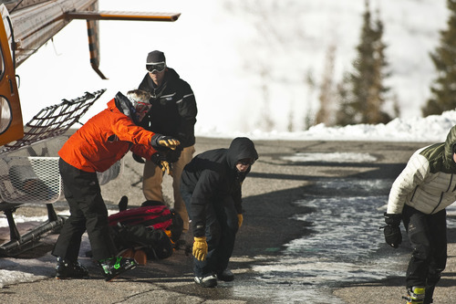 Chris Detrick  |  The Salt Lake Tribune
Two people involved in an avalanche get out of a Wasatch Powderbird helicopter at Snowbird Saturday January 28, 2012. One person died in an avalanche in the backcountry between Big and Little Cottonwood canyons late Saturday morning. Unified Police Department Lt. Justin Hoyal said a group of three people were skiing on Kessler Ridge, an area that drops down into Mineral Fork Canyon in Big Cottonwood Canyon, when the avalanche was triggered at about 11:30 a.m.