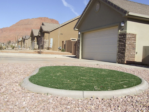 Brandon Loomis | The Salt Lake Tribune

Gravel and artificial grass create a water-wise front yard in Ivins. Washington County residents use more water per person than residents of many other Southwestern communities, and Lake Powell pipeline opponents say conservation must come before a billion-dollar investment in a new source.