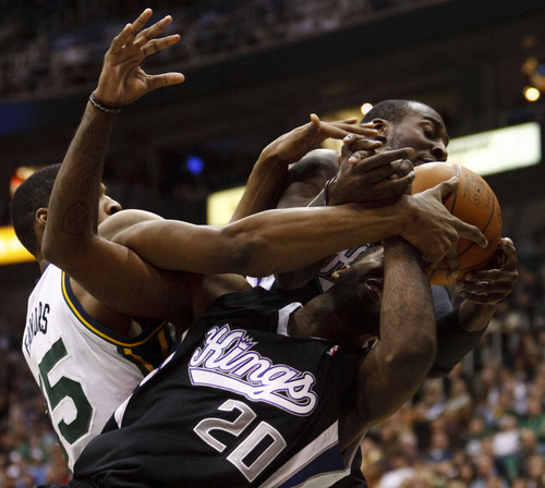 Trent Nelson  |  The Salt Lake Tribune
Sacramento's Donte Greene (20) gets tangled up with teammate J.J. Hickson and Utah Jazz forward Derrick Favors (15) in the second half of game Saturday at the EnergySolutions Arena in Salt Lake City. The Jazz downed the Kings, 96-93.