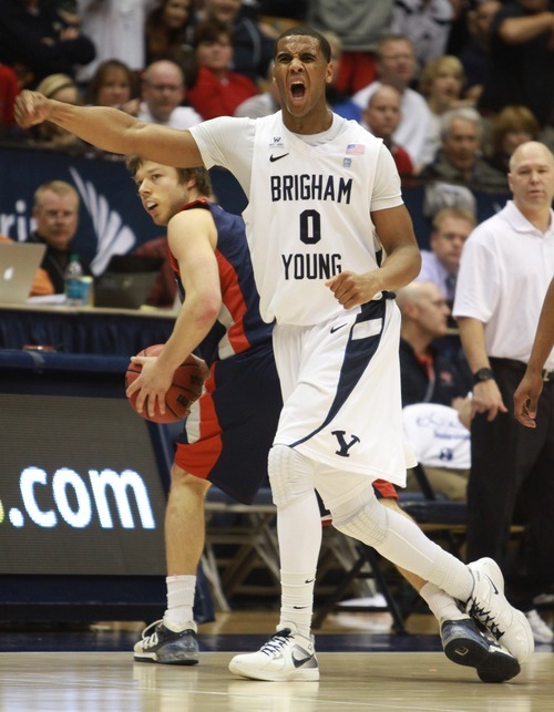 Rick Egan  | The Salt Lake Tribune 

Brigham Young Cougars forward Brandon Davies (0) celebrates as a charging call goes the way of the Cougars, in second half action, BYU vs. St Mary's in the Marriott Center in Provo, Saturday, January 28, 2012.