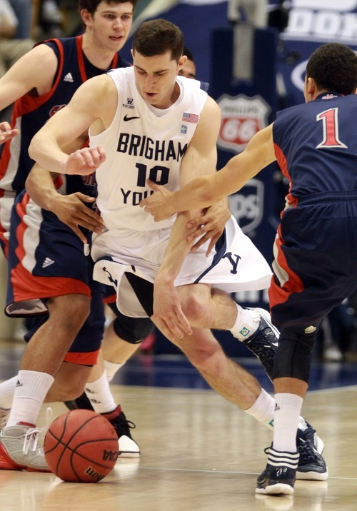 Rick Egan  | The Salt Lake Tribune 

Brigham Young Cougars guard Matt Carlino (10) dribbles through traffic,  in second half action, BYU vs. St Mary's in the Marriott Center in Provo, Saturday, January 28, 2012.