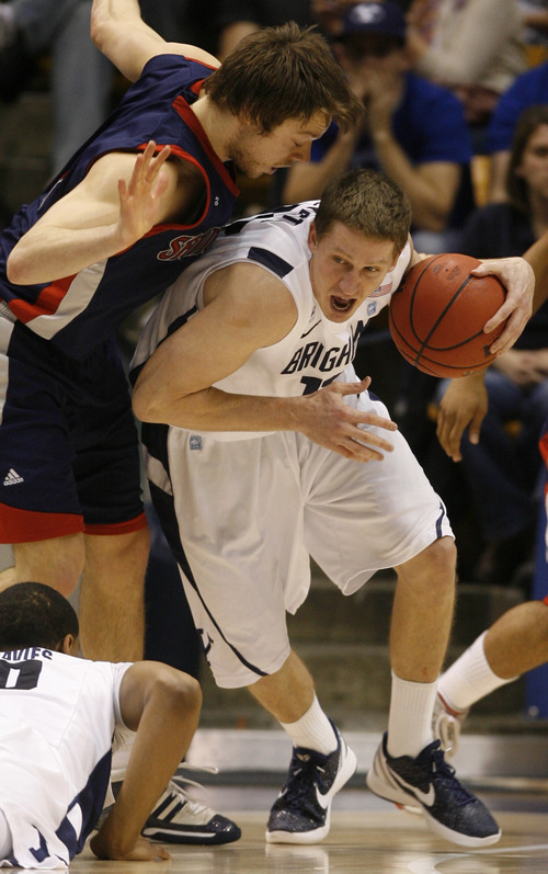 Rick Egan  | The Salt Lake Tribune 

St. Mary's Gaels guard Matthew Dellavedova (4) puts pressure on Brigham Young Cougars guard, Brock Zylstra (13)  BYU vs. St Mary's in the Marriott Center in Provo, Saturday, January 28, 2012.