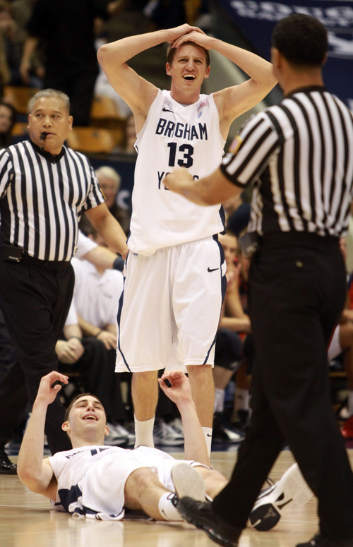 BYU'S Brock Zylstra (13) reacts as a charging foul is called on Matt Carlino (10) in second half action of an NCAA college basketball game in the Marriott Center in Provo, Utah Saturday, Jan. 28, 2012. (AP Photo/The Salt Lake Tribune, Rick Egan)