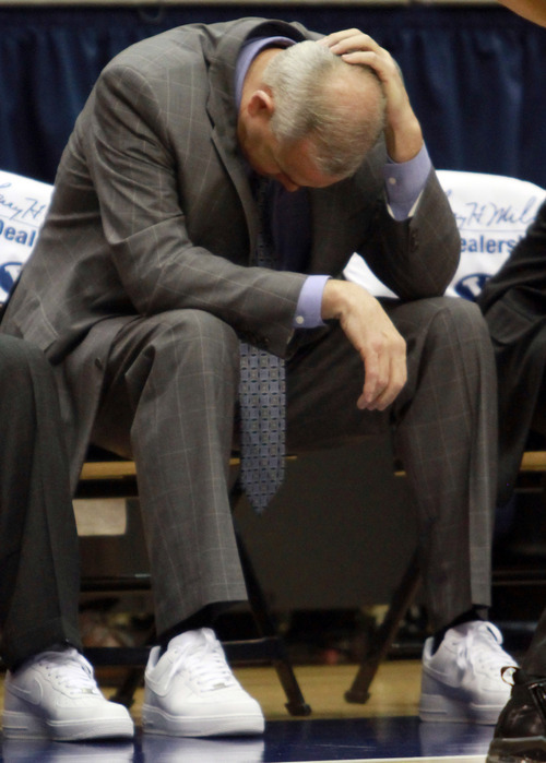 BYU head coach Dave Rose hangs his head as the Cougars fall behind  during an NCAA college basketball game in the Marriott Center in Provo, Utah Saturday, Jan. 28, 2012. (AP Photo/The Salt Lake Tribune, Rick Egan)