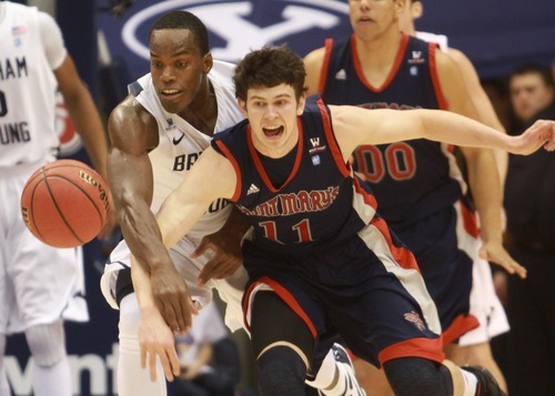 Rick Egan  | The Salt Lake Tribune 

Cougar guard Charles Abouo (1) collides with St. Mary's Gaels forward Clint Steindl (11), in basketball action, BYU vs. St Mary's in the Marriott Center in Provo, Saturday, January 28, 2012.