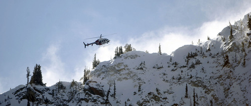 Francisco Kjolseth  |  The Salt Lake Tribune
An AirMed chopper flies into Dog lake near Brighton resort to drop-off a local highly-trained avalanche rescue dog team on Wednesday, January 25, 2012 to do avalanche victim search drills, beacon searches and helicopter training conducted by Wasatch Backcountry Rescue (WBR).