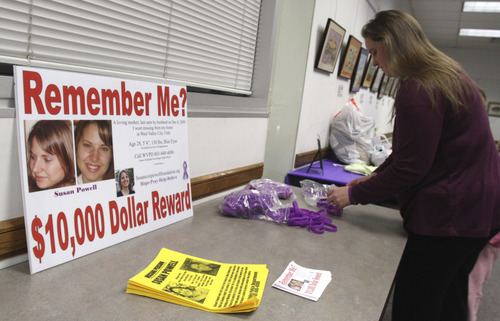 Rick Egan  | The Salt Lake Tribune 

Jennifer Graves sets up a table Monday for people to leave donations. Friends and family of missing West Valley City woman Susan Cox Powell gathered donations for the Christmas Box House, at the Hunter Library in West Valley City.