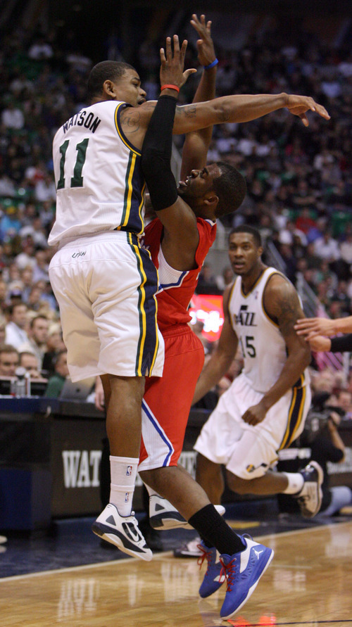 Steve Griffin  |  The Salt Lake Tribune


Utah's Earl Watson fires a pass through the arms of Chris Paul, of the Clippers, during first half action of the Jazz versus Clippers game at EnergySolutions Arena in Salt Lake City, Utah  Wednesday, February 1, 2012.
