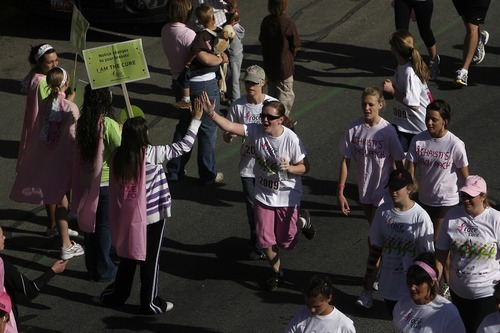 Participates run south on 400 west during the 13th annual Komen Race for the Cure in Salt Lake City May 9, 2009. About 18,000 people participated in fundraiser to raise money to fight cancer.
 
Chris Detrick/The Salt Lake Tribune