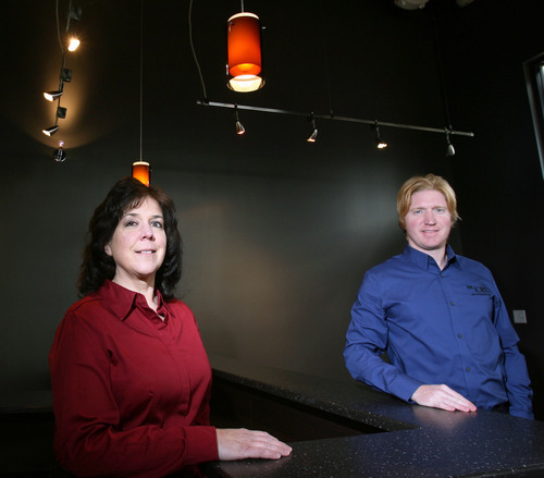 Steve Griffin  |  The Salt Lake Tribune
Trevor Williams, right, is joined by Dr. Lisa Royer in their soon-to-be opened Sandy location for The Joint, a growing chain of chiropractic offices.