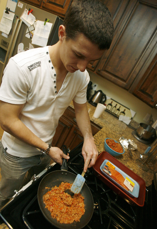 Francisco Kjolseth  |  The Salt Lake Tribune
Real Salt Lake player Will Johnson warms up turkey chili at his home on Thursday, Jan. 26, 2012. Will gets nutritional counseling to make sure he's eating properly for endurance and for his sensitive stomach.