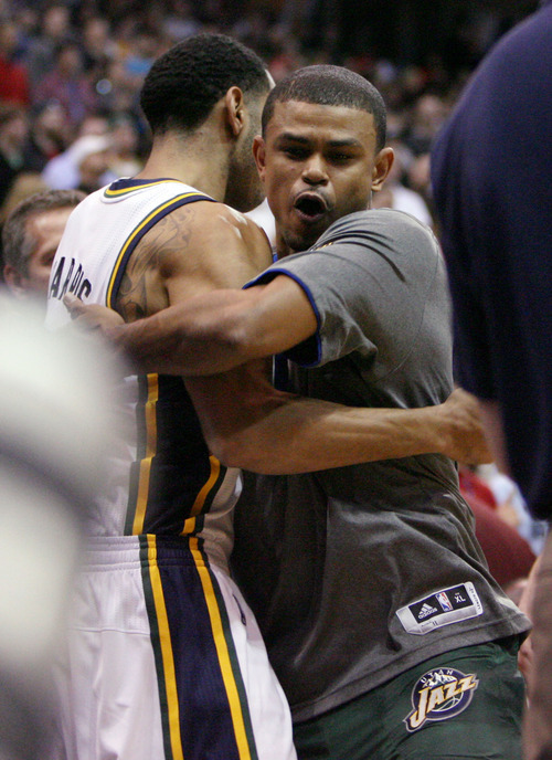 Steve Griffin  |  The Salt Lake Tribune


Utah guards Devin Harris, left, and Earl Watson embrace as the Jazz starters take the floor at the start of their game against the Clippers game at EnergySolutions Arena in Salt Lake City, Utah  Wednesday, February 1, 2012.