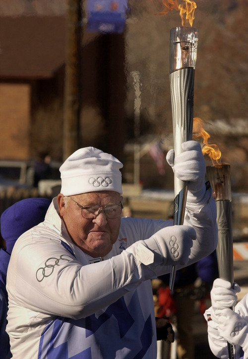 Steve Griffin | Tribune file photo
An emotional James Walker of Moab holds the torch high as he starts his leg of the torch relay in his hometown.