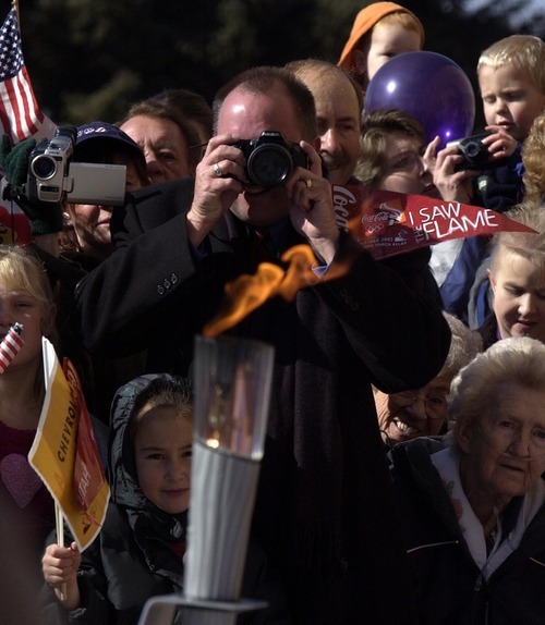 Trent Nelson | Tribune file photo
Citizens enjoy an up-close view as the torch arrives in Beaver, where a small ceremony and balloon-release at Beaver High School commemorated the occasion.