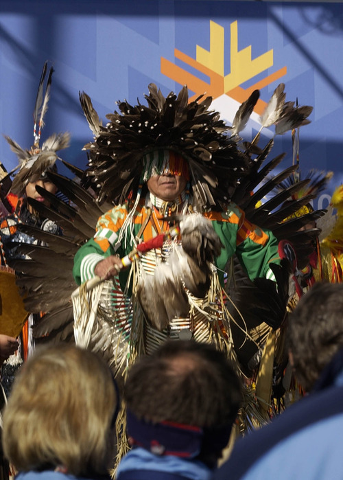 Leah Hogsten | Tribune file photo
Omaha Nation dancer Michael Walker and members of the Allen Canyon Utes welcomed members of the U.S. Olympic Team to the Olympic Village with traditional Native American dances.