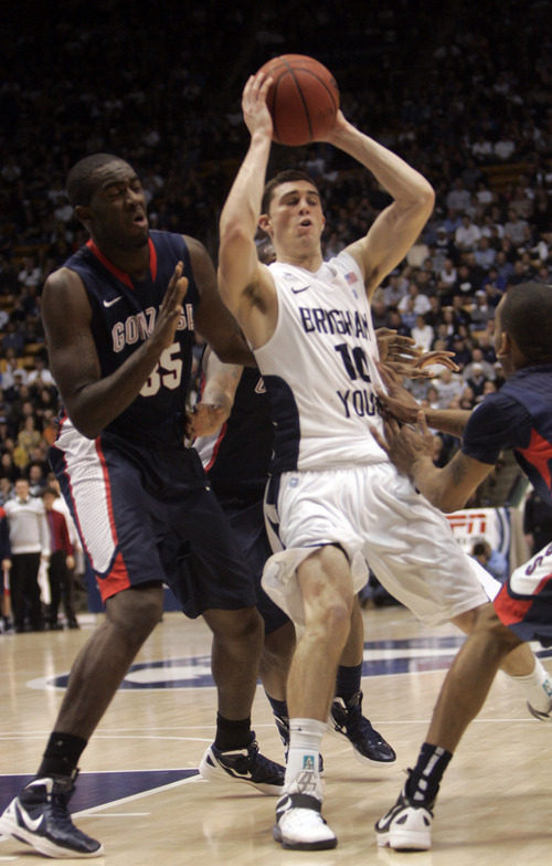 Kim Raff |The Salt Lake Tribune
BYU player Matt Carlino drives the basket as Gonzaga player Sam Dower defends during the second half at the Marriott Center in Provo, Utah on February 2, 2012.