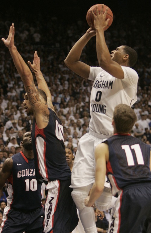 Kim Raff |The Salt Lake Tribune
BYU player Brandon Davies takes a shot over the head of Gonzaga player Robert Sacre during the first half at the Marriott Center in Provo, Utah on February 2, 2012.