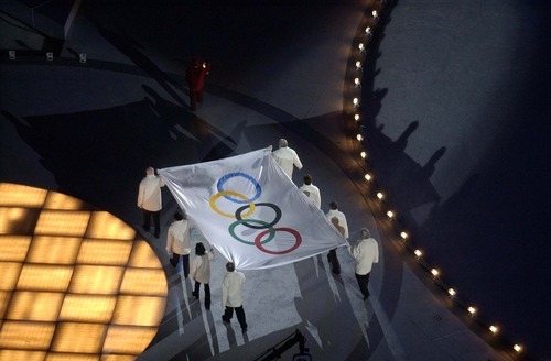 Tribune file photo
The Olympic flag makes its entrance at the Opening Ceremony for the 2002 Games in Salt Lake City.