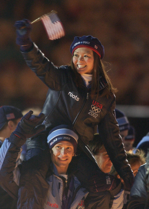 Tribune file photo
Pairs figure skaters Kyoko Ina and John Zimmerman enter the stadium during Closing Ceremonies of the 2002 Salt Lake Olympics.