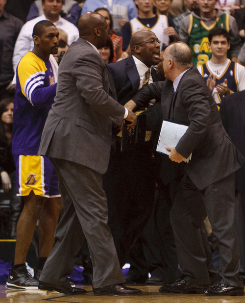 Trent Nelson  |  The Salt Lake Tribune
Los Angeles coach Mike Brown is restrained after being ejected from the game in the fourth quarter as the Utah Jazz host the Los Angeles Lakers, NBA basketball Saturday, February 4, 2012 at EnergySolutions Arena in Salt Lake City, Utah.