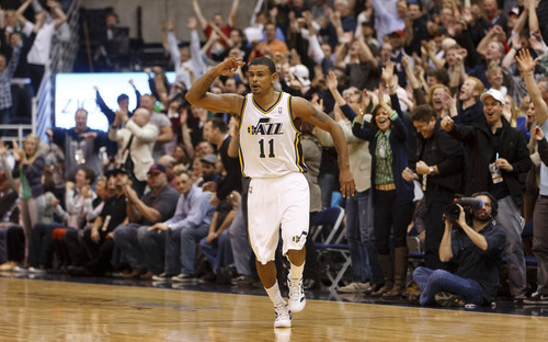 Trent Nelson  |  The Salt Lake Tribune
Utah Jazz guard Earl Watson (11) celebrates a three-point shot that put the Jazz up 94-83 in the fourth quarter. Utah Jazz host the Los Angeles Lakers, NBA basketball Saturday, February 4, 2012 at EnergySolutions Arena in Salt Lake City, Utah.