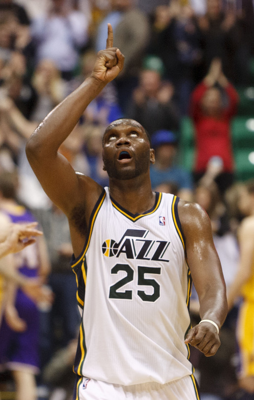 Trent Nelson  |  The Salt Lake Tribune
Utah Jazz center/forward Al Jefferson (25) points to the roof as the Jazz lead in the fourth quarter as the Utah Jazz host the Los Angeles Lakers, NBA basketball Saturday, February 4, 2012 at EnergySolutions Arena in Salt Lake City, Utah.
