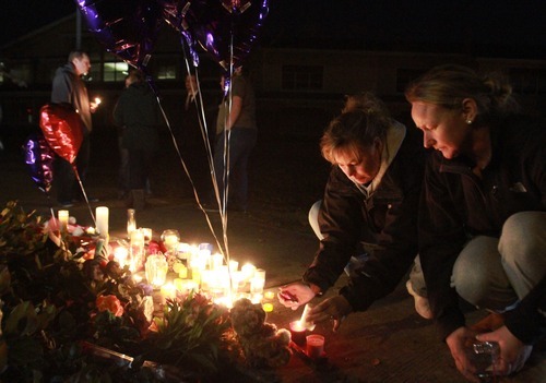 Rick Egan  | The Salt Lake Tribune 



Puyallup residents, Tracy Jamison (left) and Trisha Edling (right) light candles at a memorial at Carson Elementary School in Puyallup Washington, Sunday, February 5, 2012.