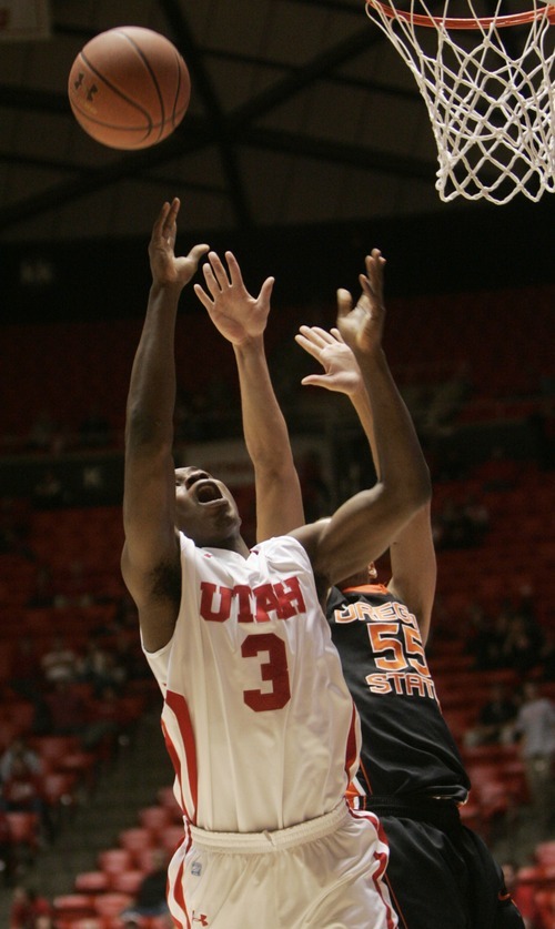 Kim Raff |The Salt Lake Tribune
University of Utah player Anthony Odunsi takes a shot as Oregon State player Roberton Nelson defends during the second half at the Huntsman Center in Salt Lake City, Utah on February 4, 2012. Utah went on the lose the game 58-76.