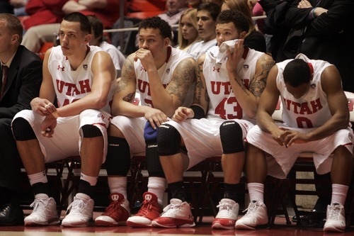 Kim Raff |The Salt Lake Tribune
(from left) University of Utah players Jason Washburn, Javon Dawson, Cedric Martin, and Chris Hines sit on the bench in the final minutes as they trial by 18 points against Oregon State at the Huntsman Center in Salt Lake City, Utah on February 4, 2012. Utah went on the lose the game 58-76.
