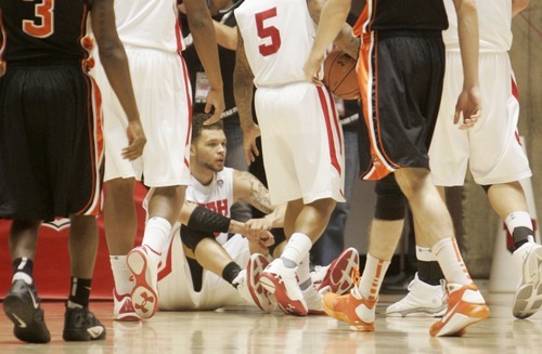 Kim Raff |The Salt Lake Tribune
University of Utah player Cedric Martin takes a moment on the floor after being called on a foul in a game against Oregon State at the Huntsman Center in Salt Lake City, Utah on February 4, 2012. Utah went on the lose the game 58-76.