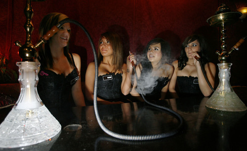 Steve Griffin  |  Tribune File Photo
 Huka girls Beth Berg, Cassie Goodfrey, Josephine Fausto and Shannon Lehew smoke from water pipes at the Huka Bar and Grill The establishment's owner has negotiated a deal with Rep. Brad Last that he says will keep his doors open for at least the next five years.