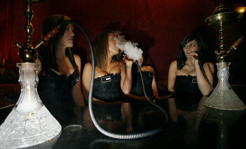 Steve Griffin  |  Tribune File Photo
The Huka girls at the Huka Bar and Grill. Owner Nathan Porter said a bill that would have included hookahs under the Indoor Clean Air Act would have put him out of business. A deal means he'll get a five-year reprieve.