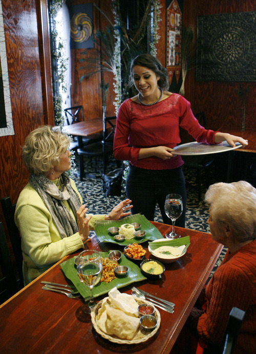 Francisco Kjolseth  |  The Salt Lake Tribune
Ariana Selvaratnam, co-owner of The Banana Leaf at 409 N. University Ave. in Provo, explains some of the dishes ordered by first-time customers Patti Heal, left, and her mother-in-law Louise Heal on Thursday, Feb. 2, 2012.