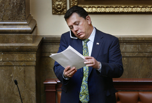 Scott Sommerdorf  |  The Salt Lake Tribune             
Rep. Stephen Sandstrom, R-Orem, reads through some documents on the floor of the Utah House earlier this week. He has been in negotiations over his new immigration bill, which is expected to be released Wednesday.