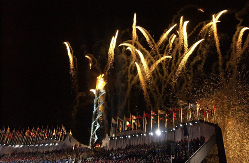 Leah Hogsten | Tribune file photo
Fireworks explode above the Olympic cauldron at Rice-Eccles Stadium during the Opening Ceremony.