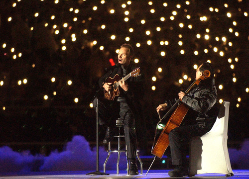 Rick Egan | Tribune file photo
Sting and cellist Yo Yo Ma perform during the Opening Ceremony at Rice-Eccles Stadium.