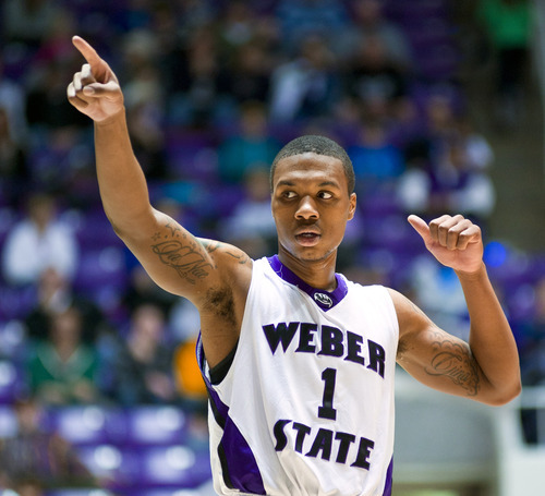 Weber State Wildcats guard Damian Lillard acknowledges the crowd's cheers against the Southern Utah Thunderbirds during the first half Saturday, Dec. 10, 2011, at the Dee Events Center in Ogden, Utah. (© 2011 Douglas C. Pizac/Special to The Tribune)