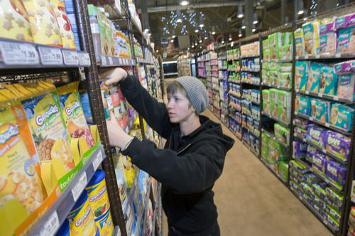 Al Hartmann  |  The Salt Lake Tribune
Jessica Dempson, natural and specialty foods manager at Harmons City Creek store, prepares shelves for the Wednesday opening.