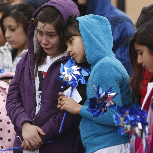 Trent Nelson  |  The Salt Lake Tribune
Raquel Trujillo, left, is comforted by Saray Becerra at a community pinwheel vigil for Charlie and Braden Powell in the Municipal Gardens Playground Thursday in Ogden. The event was put on by Prevent Child Abuse Utah.