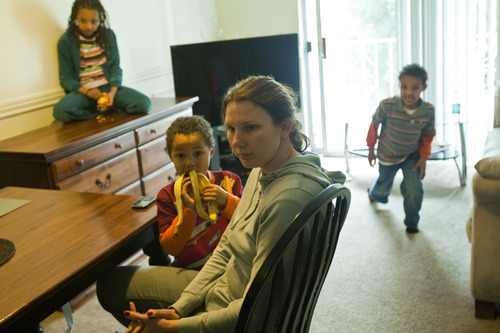 Chris Detrick  |  The Salt Lake Tribune
Vitalina Lazarus and her kids Davian, 3, Lina, 8, and Daniel, 5, play in their apartment Friday February 10, 2012.