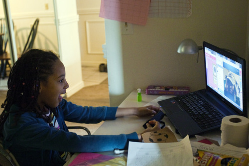 Chris Detrick  |  The Salt Lake Tribune
Lina Lazarus, 8, talks to her dad Harold, who is currently studying in the Ukraine, through Skype in their apartment Friday February 10, 2012.