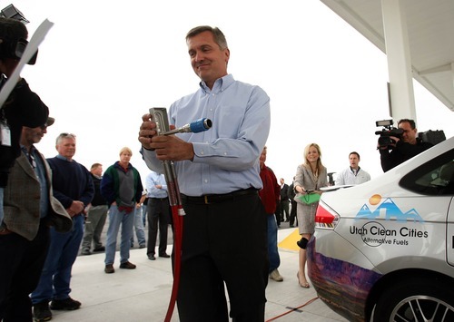 Leah Hogsten  |  The Salt Lake Tribune
Utah Congressman Jim Matheson replaces the natural gas fuel pump after refueling a NGV with the help of the car's owner during a press conference in April, 2011, to promote legislation that would give tax credits and incentives to NGV production and refueling stations.