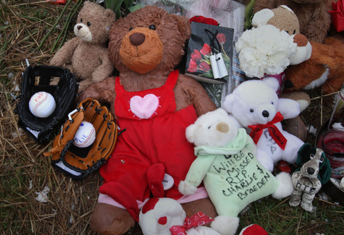 Rick Egan  | The Salt Lake Tribune 

Stuffed animals, balloons, and children's toys such as Pokémon cards make up a memorial near the home where Josh Powell took his life and the lives of Charlie and Braden, in Graham, Washington, Wednesday, February 8, 2012.