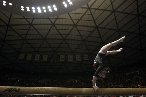 Chris Detrick  |  The Salt Lake Tribune
Stephanie McAllister competes on the beam during the gymnastics meet against Utah State at the Huntsman Center Friday January 13, 2012.