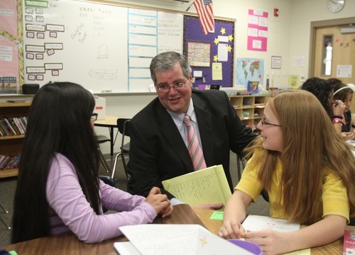 Rick Egan  | The Salt Lake Tribune 

Ogden School District Superintendent Brad Smith visits with sixth-grade students Araceli Salgado (left) and Kira Ware at Odyssey Elementary School. Jan. 5, 2012.