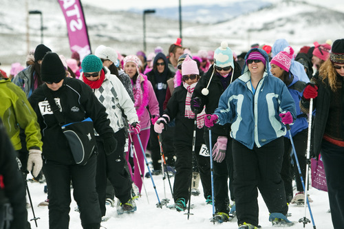 Chris Detrick  |  The Salt Lake Tribune
Participants snowshoe during the Tubbs Romp to Stomp Out Breast Cancer Snowshoe Series at the Round Valley Trails at Quinn's Junction Saturday February 11, 2012. The event raises money for the Salt Lake City affiliate of Susan G. Komen for the Cure.