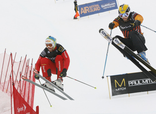 Scott Sommerdorf  |  The Salt Lake Tribune             
American Robert Mahre (right), leads Swiss skiier Phillip Gasser through the final jump of heat 6 on the Men's Skicross event at The Canyons, Saturday February 11, 2012.