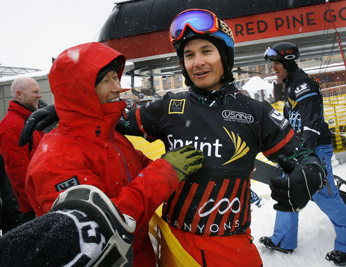 Scott Sommerdorf  |  The Salt Lake Tribune             
Park City snowboarder Graham Watanabe meets with his father, Scott Watanabe, left, after his fifth place finish in Men's Snowboardcross at the U.S. Grand Prix held The Canyons, Sunday February 12, 2012.